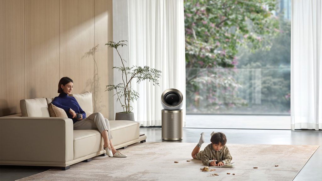 An air purifier stands in the center of the living room.
